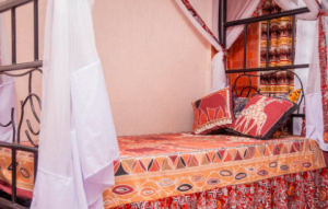 Deluxe bed at Jet Villas Entebbe